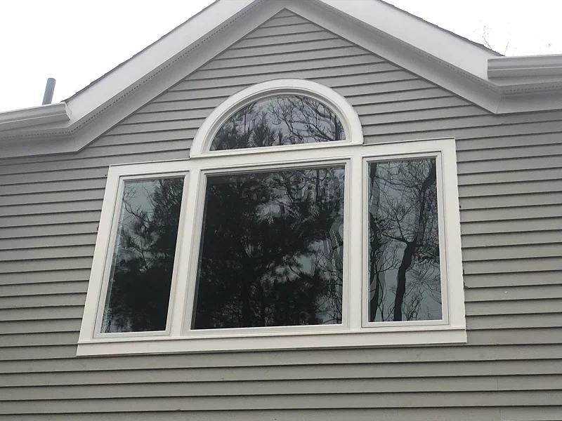 Andersen 400 Series casement and round top window with PVC exterior trim